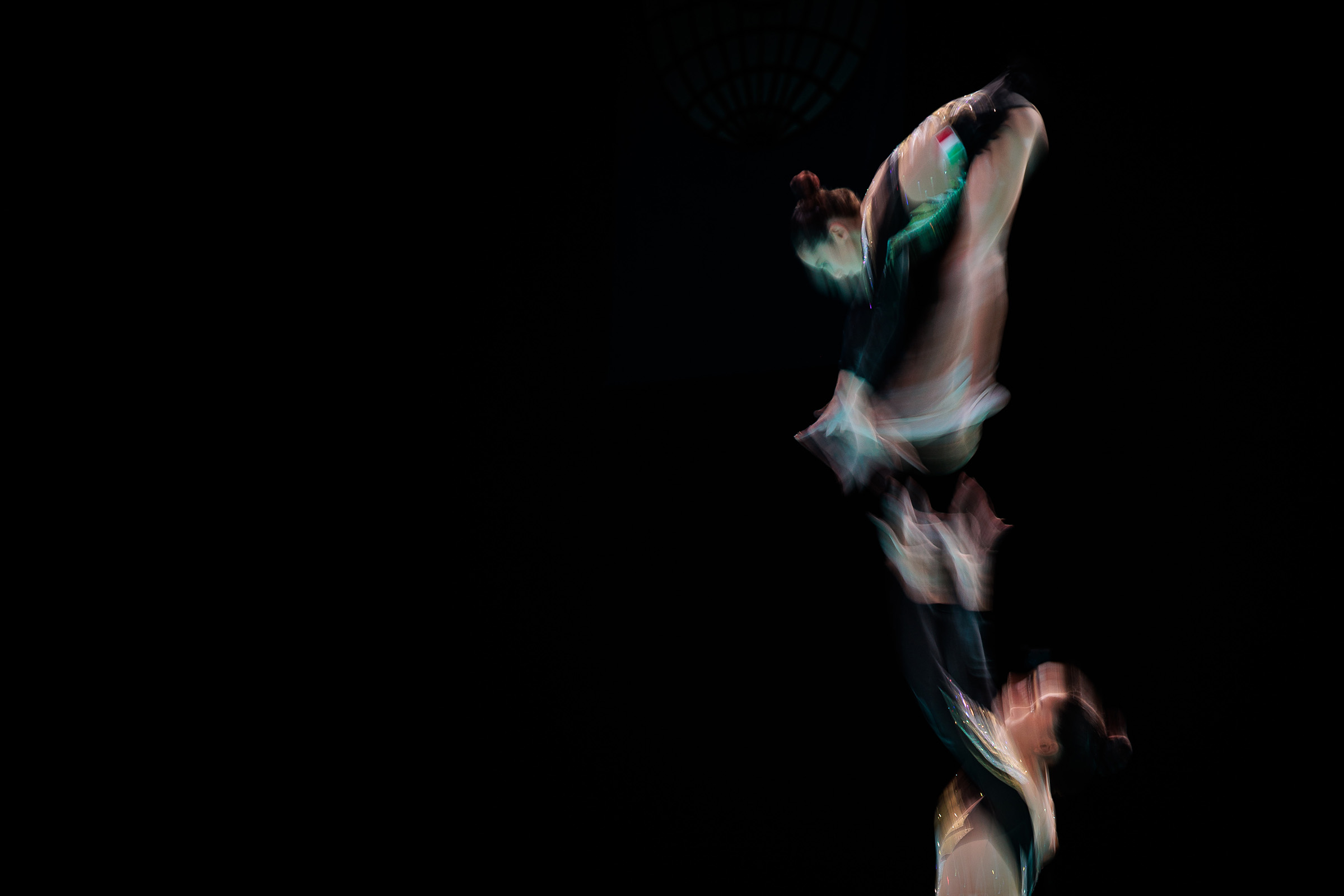 Women Pair in action during the Acrobatics Gymnastics World Age Groups, photo taken with slow shutter.