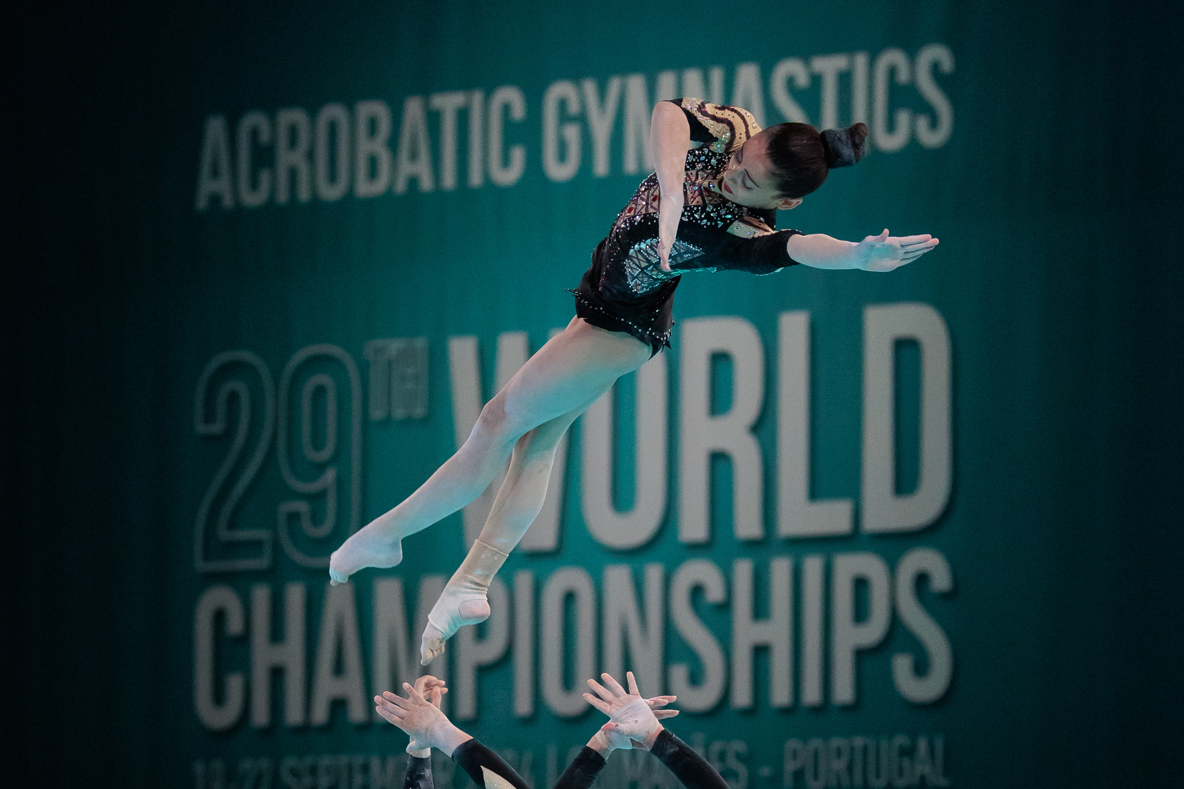 Women Group in dynamic action during the Acrobatics Gymnastics World Championship